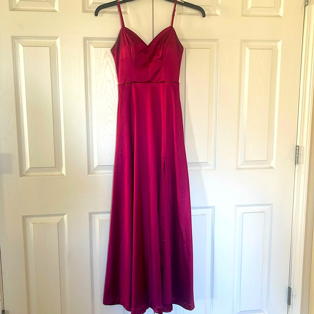 Long prom dress. Slit in front and has pockets